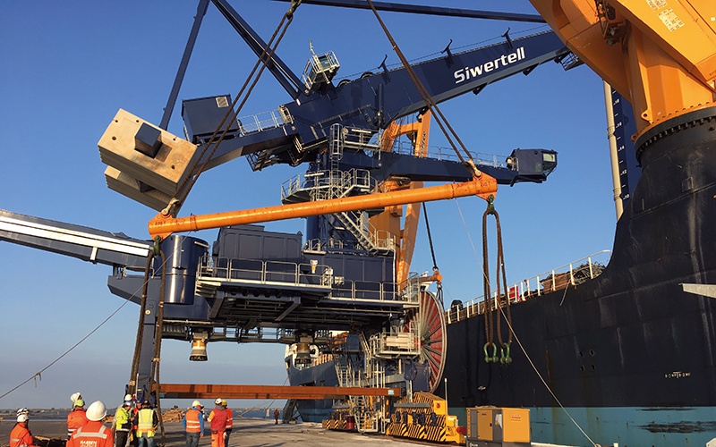 Lift of Siwertell unloader onboard on the vessel