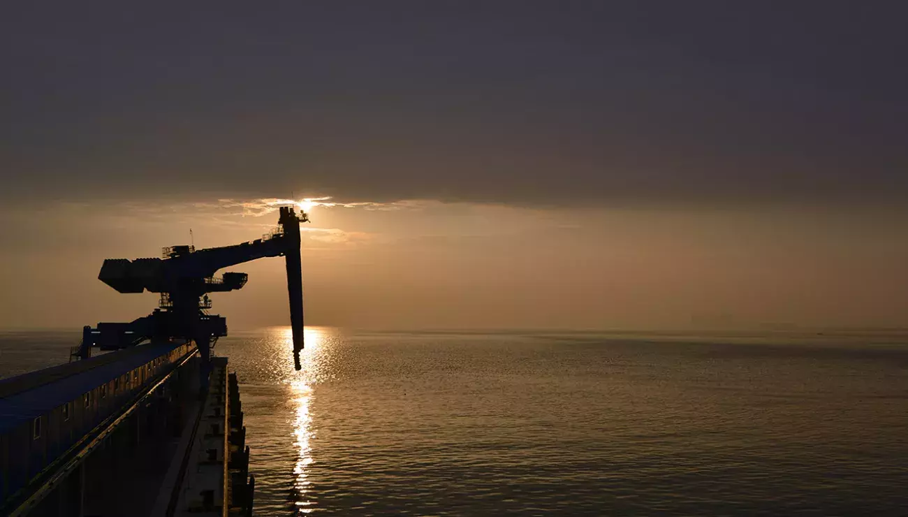 Ship unloader in sunset