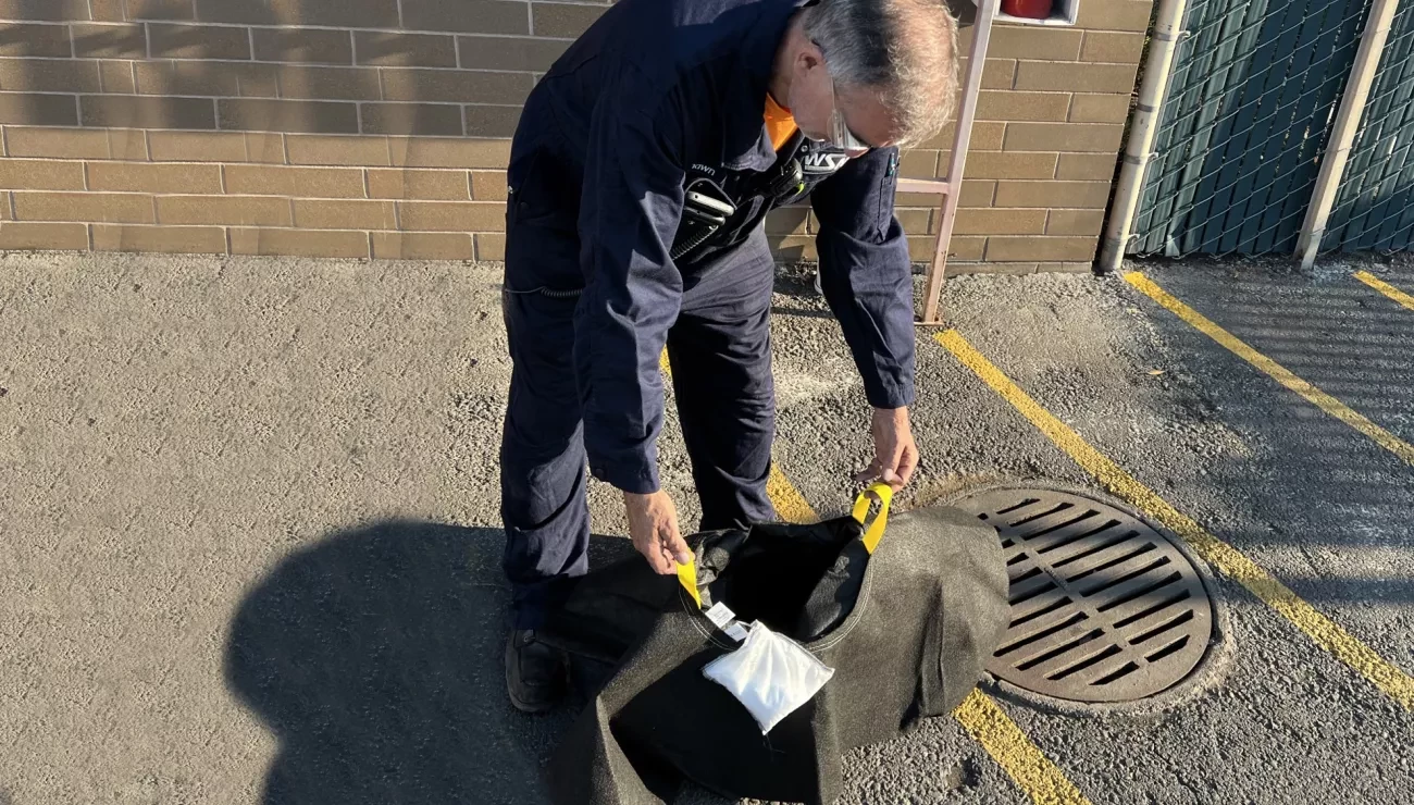 Man holding a drain system called witches hat