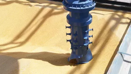Closeup of Inlet feeder and vertical screw conveyor unloading grain from barge