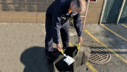 Man holding a drain system called witches hat
