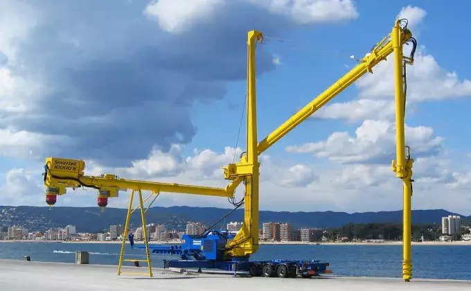 Yellow Siwertell mobile unloader by the harbor