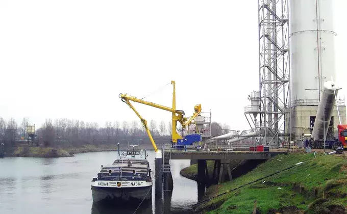 Yellow Siwertell mobile unloader by the harbor