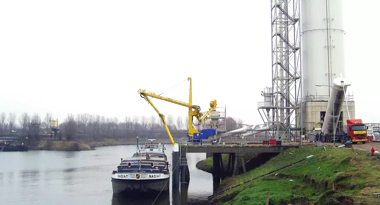 Yellow Siwertell mobile unloader by the harbor